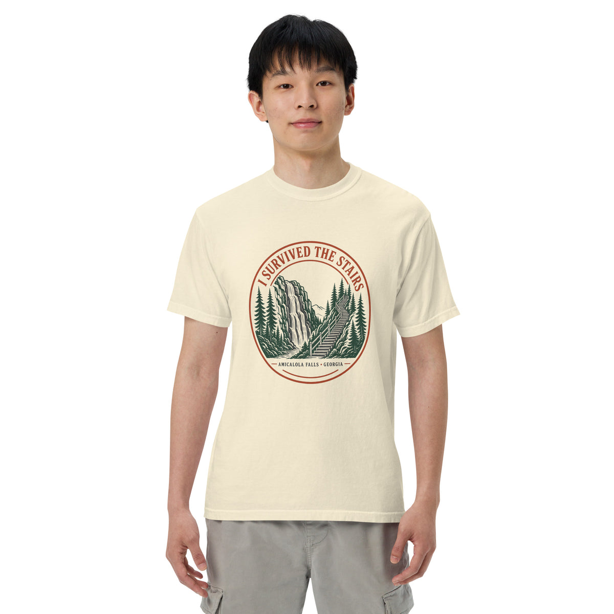 Model wearing the ivory I Survived the Stairs Amicalola Falls tee, front view, arms relaxed at sides
